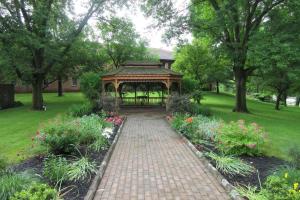 a garden with a gazebo in a park at Quality Inn & Suites Owego in Owego