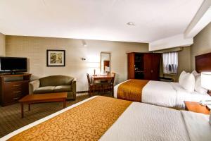 Postel nebo postele na pokoji v ubytování Quality Inn