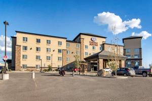 a large building with a parking lot in front of it at Comfort Suites Saskatoon in Saskatoon