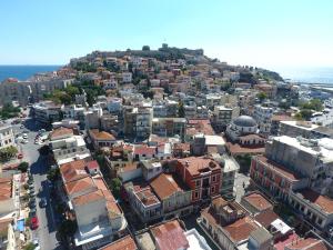 an aerial view of a city with buildings and the ocean at Minimal Culture Boutique Rooms in Kavála