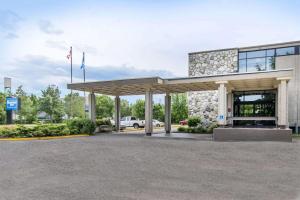 a gas station with a car parked in front of it at Travelodge by Wyndham Trois-Rivieres in Trois-Rivières