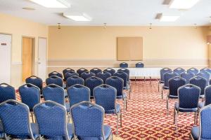 an empty conference room with chairs and a podium at Quality Inn & Suites in Hawkesbury +54 photos