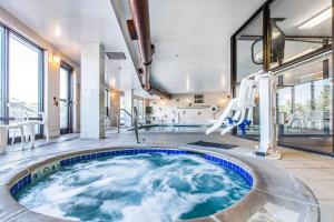 a jacuzzi tub in a house with a slide at Comfort Suites Summit County in Dillon