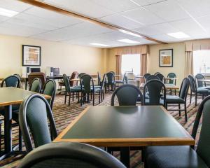 an empty classroom with tables and chairs in a room at Quality Inn Colorado Springs Airport in Colorado Springs