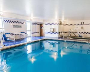 a swimming pool with blue water in a room at Quality Inn & Suites Golden - Denver West in Lakewood