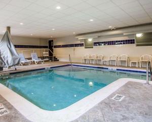 a large swimming pool with chairs in a hotel at Sleep Inn & Suites Niantic North in Niantic