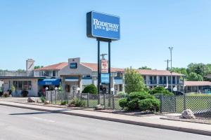 a sign for a restaurant for service on a street at Rodeway Inn & Suites Colorado Springs in Colorado Springs