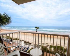 a balcony with a view of the beach at Comfort Inn & Suites Ormond Beach Oceanfront in Ormond Beach