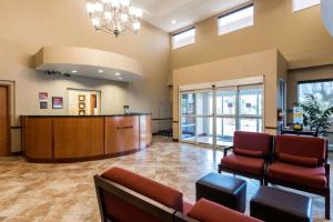 a lobby with a waiting room and a reception desk at Comfort Suites Tampa Airport North in Tampa