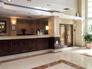 a lobby with a bar in a building at Rodeway Inn South Miami - Coral Gables in Miami