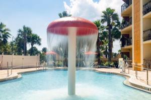 a fountain in the middle of a pool at Castillo Real Resort Hotel in Saint Augustine Beach