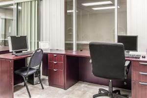 an office with two desks with two computers on them at Quality Inn & Suites Conference Center in New Port Richey