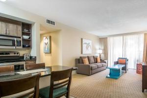a living room with a table and a couch at Bluegreen Vacations Hammocks at Marathon, Ascend Collection Resort in Marathon