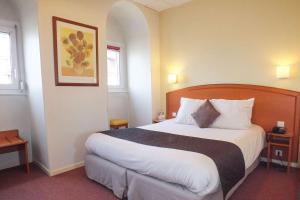 Postel nebo postele na pokoji v ubytování Hotel Cecil Metz Gare