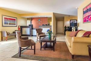 a living room with a couch and chairs at Quality Inn Columbus in Columbus