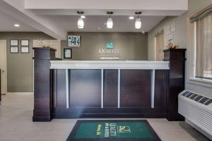 a lobby with a bar in a hospital at Quality Inn & Suites Athens University Area in Athens