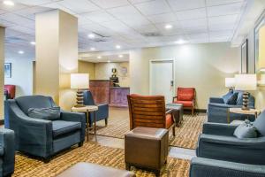 a waiting room at a hospital with chairs and tables at Comfort Inn Atlanta Downtown South in Atlanta