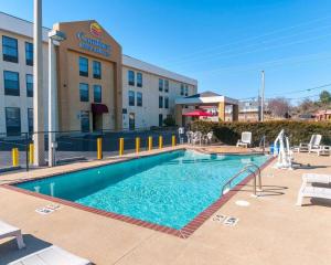 a swimming pool in front of a hotel at Comfort Inn & Suites in La Grange