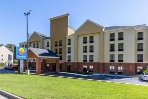 a building with a sign in front of it at Comfort Inn & Suites Dalton West in Dalton