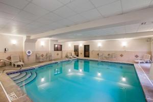 a large swimming pool in a hotel room at Comfort Suites Locust Grove Atlanta South in Locust Grove