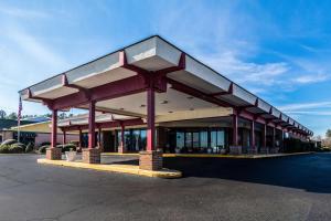 a large building with a red and white roof at Econo Lodge Inn & Suites Conference Center Dublin in Dublin