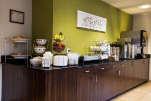 a kitchen with a counter with food on it at Sleep Inn Douglasville in Douglasville