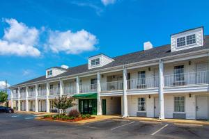 a large white building with white columns at Quality Inn Lagrange in La Grange
