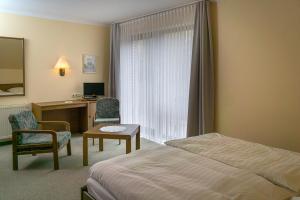 Katil atau katil-katil dalam bilik di Hotel Tini