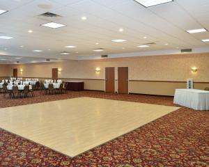 a banquet hall with a dance floor and tables at Quality Inn & Suites Fort Madison near Hwy 61 in Fort Madison +39 photos