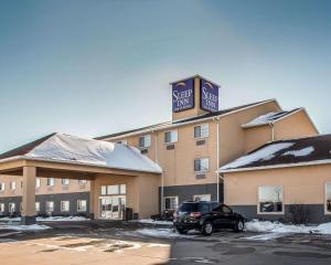 a hotel with a car parked in front of it at Sleep Inn & Suites Mount Vernon in Mount Vernon