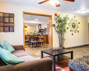 a living room with a couch and a table at Quality Inn & Suites Ankeny-Des Moines in Ankeny