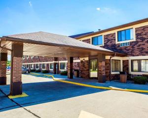 a large building with a yellow fire hose at Quality Inn & Suites in Champaign