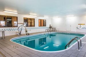 a large swimming pool in a room with at Econo Lodge & Suites in Pekin