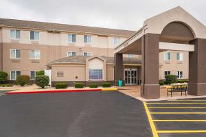 a large building with a red carpet in a parking lot at Sleep Inn & Suites in Danville