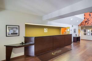an office with a desk and a yellow wall at Sleep Inn & Suites in Danville +30 photos