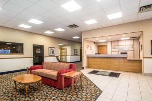 a waiting room with a couch and a table at Quality Inn Morris I-80 in Morris