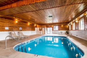 a large indoor swimming pool with a wooden ceiling at Quality Inn Morris I-80 in Morris