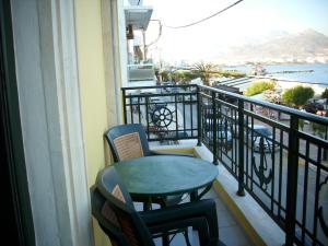 a table and chairs on a balcony with a view at By Captains Studio in Ierapetra