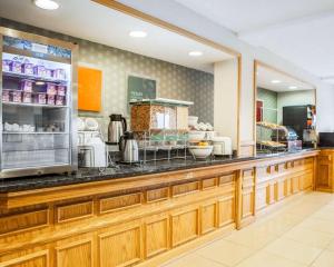 a kitchen with a counter with food on it at Comfort Inn Bourbonnais near I-57 in Bourbonnais