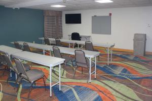 a classroom with tables and chairs and a screen at Quality Inn North Vernon in North Vernon +35 photos