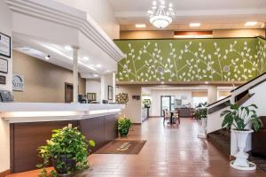 a lobby of a hospital with potted plants at Sleep Inn & Suites Columbus in Columbus