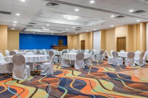 a conference room with tables and chairs on a carpet at Quality Inn & Suites Bedford West in Bedford +34 photos