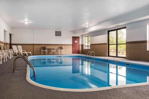 a pool with blue water in a building at Quality Inn & Suites Anderson I-69 in Anderson