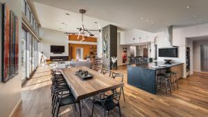 a kitchen with a table, chairs and a microwave at Mountain Shadows Resort Scottsdale in Scottsdale