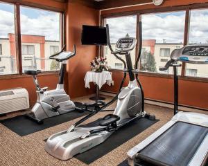two exercise bikes in a room with windows at Quality Inn Seekonk-Providence in Seekonk