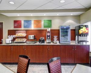 a fast food restaurant with a counter with food at The Inn At Woburn - Boston in Woburn