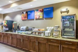 a kitchen with a counter with food on it at Comfort Inn in Frederick