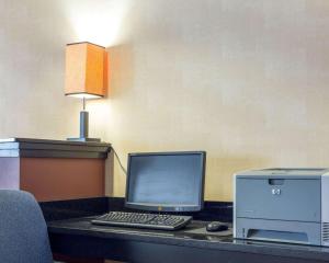 
a desk with a laptop computer and a monitor at Comfort Inn Civic Center in Augusta
