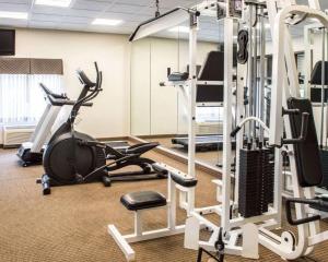 a gym with several treadmills and exercise bikes at Sleep Inn & Suites in Laurel
