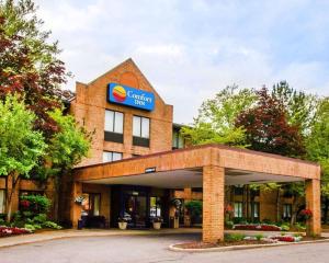 a building with a sign on top of it at Comfort Inn of Livonia in Livonia